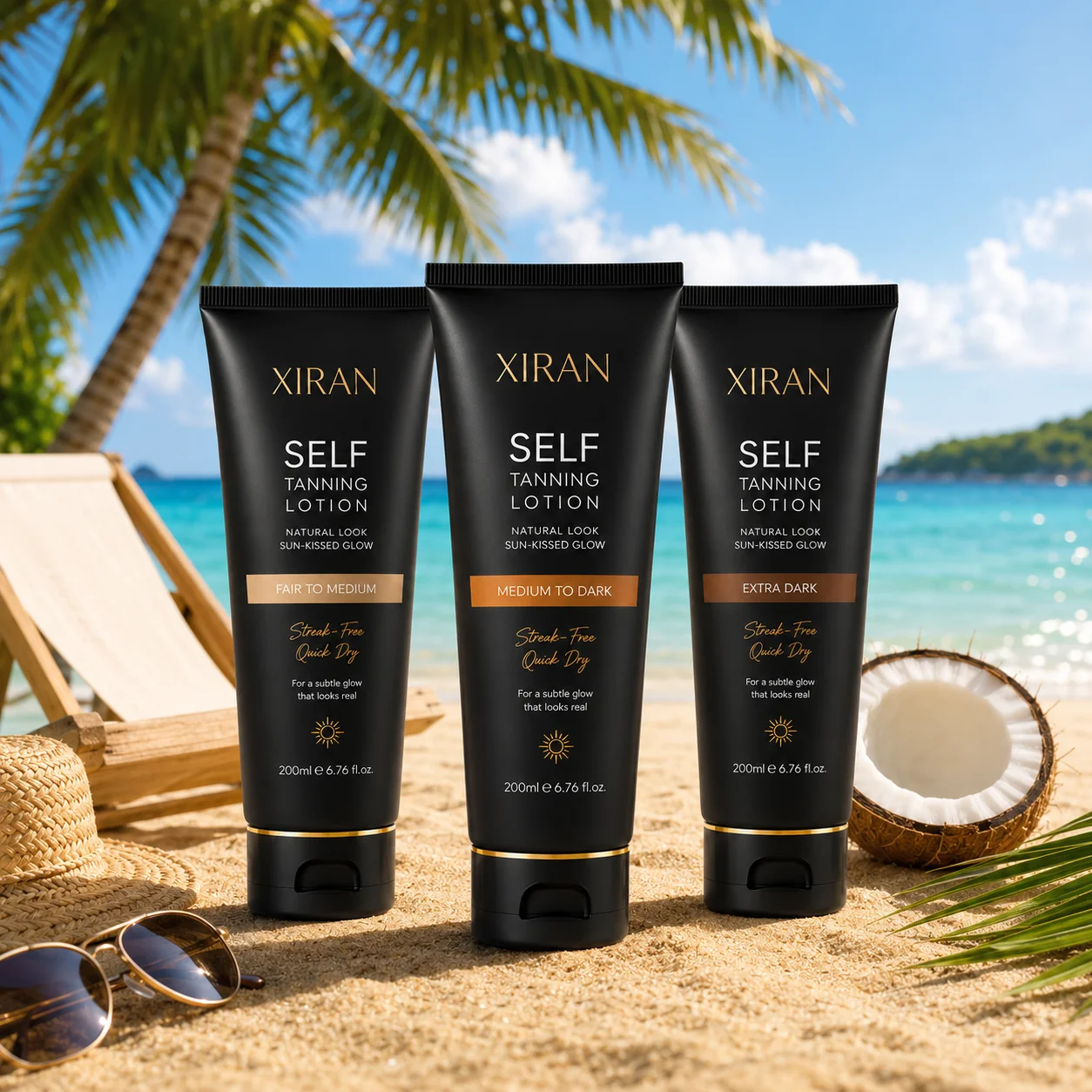 Three Xiran self-tanning lotion bottles for different skin tones displayed on a sandy beach with a coconut, sunglasses, and beach chair.